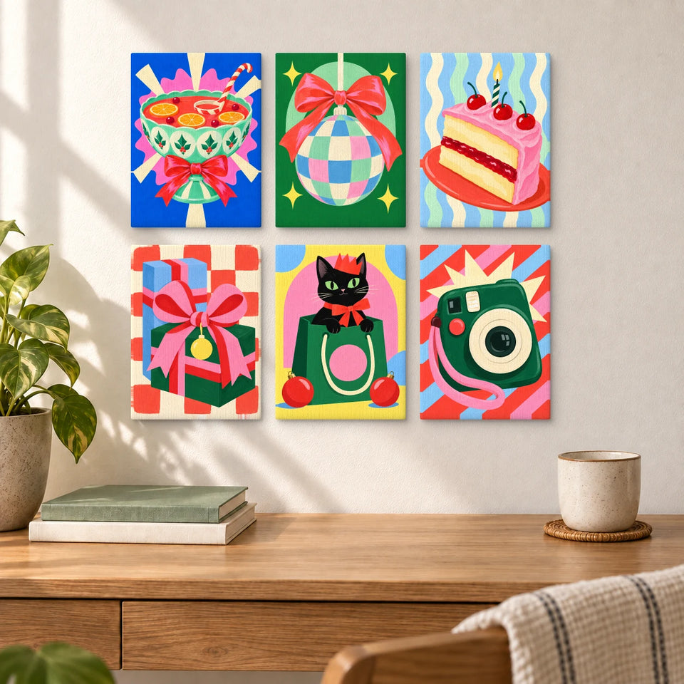 Friendsmas Pop Party — six completed mini paintings displayed above a desk.