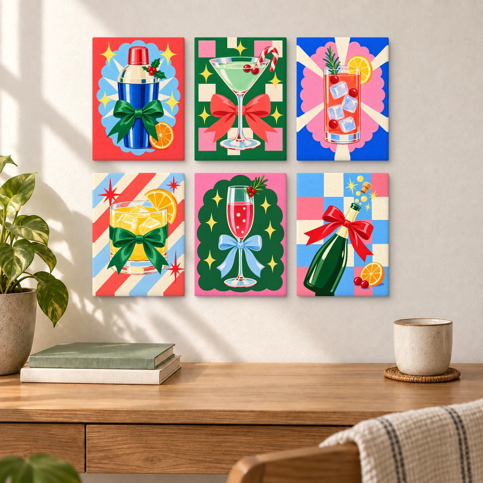 Christmas Cocktail Club — six completed mini paintings displayed above a desk.
