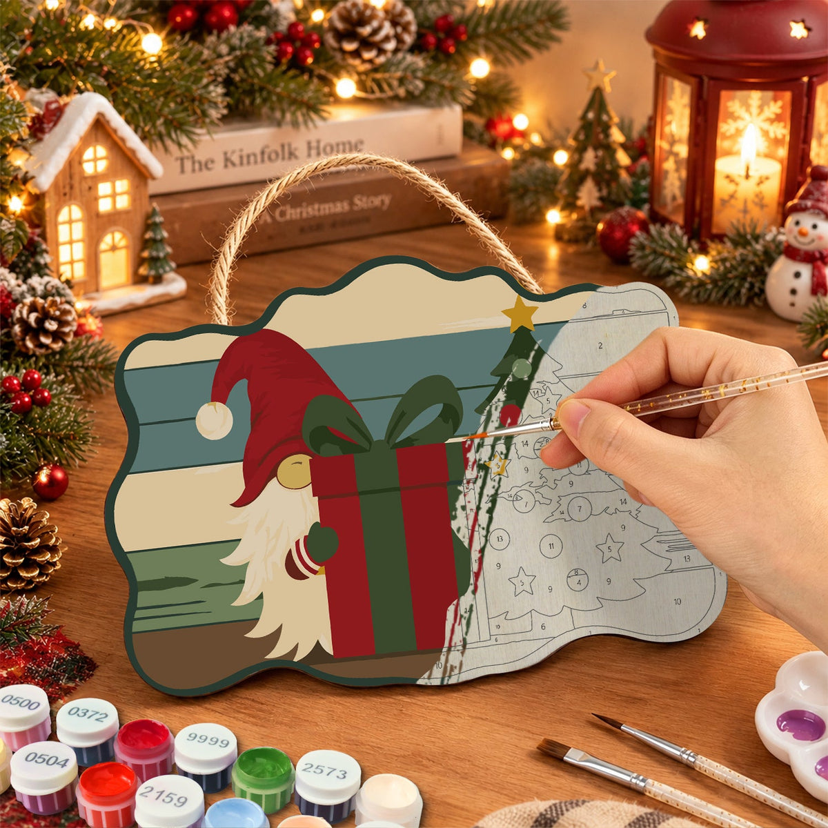Painting the wooden sign at a festive table