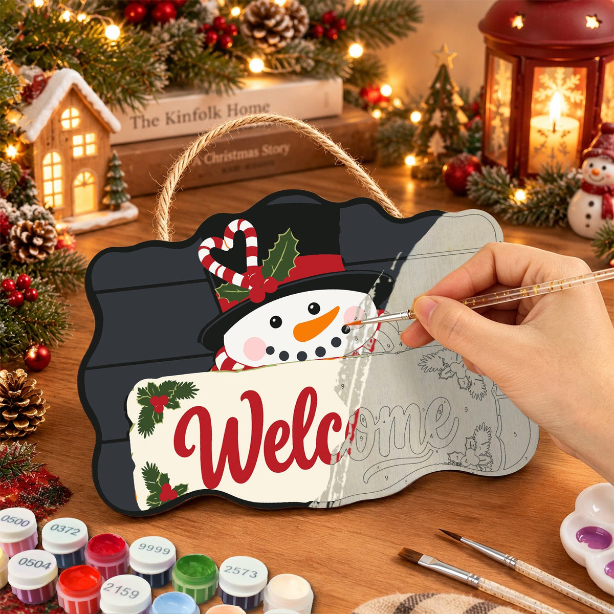 Painting the wooden sign at a festive table