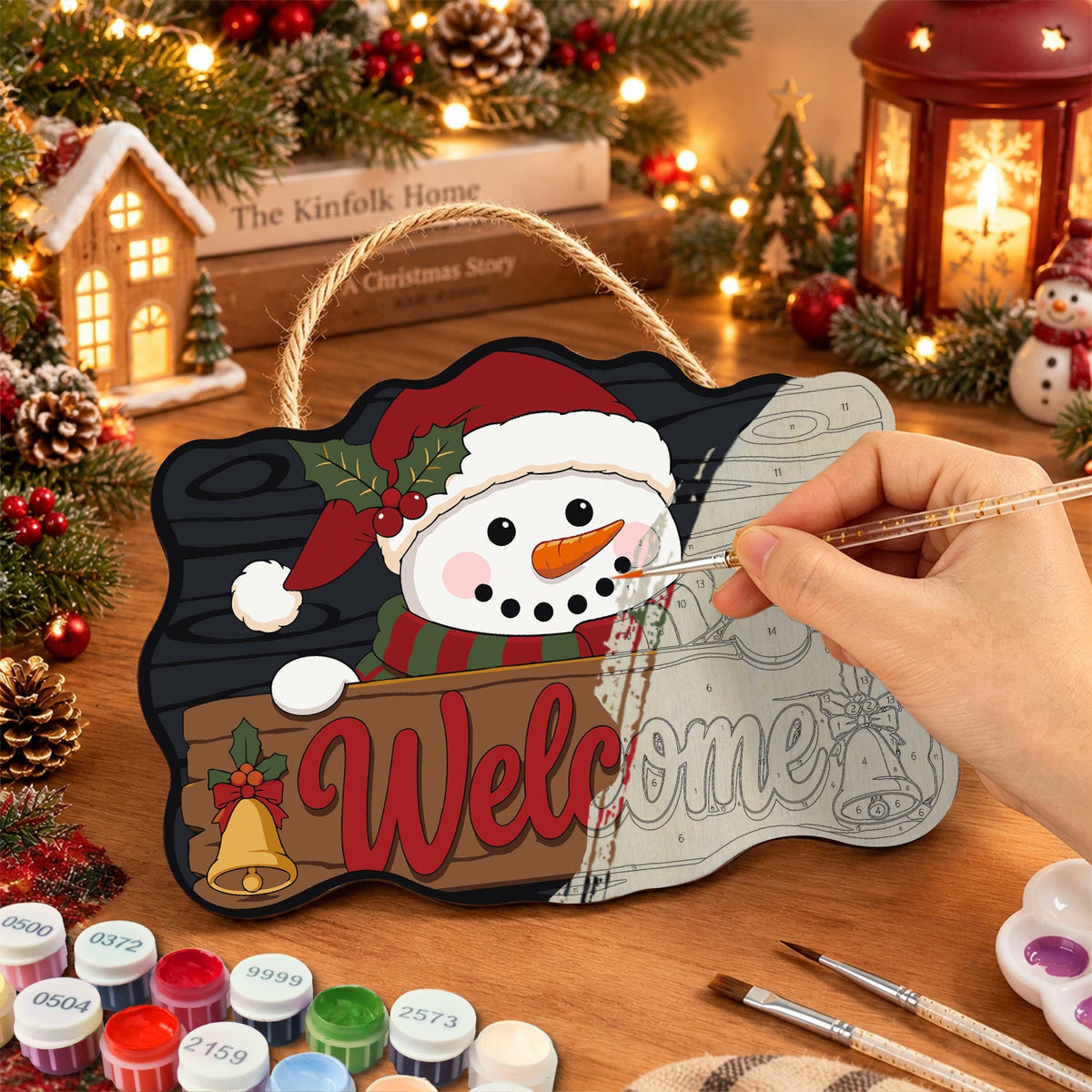 Painting the wooden sign at a festive table