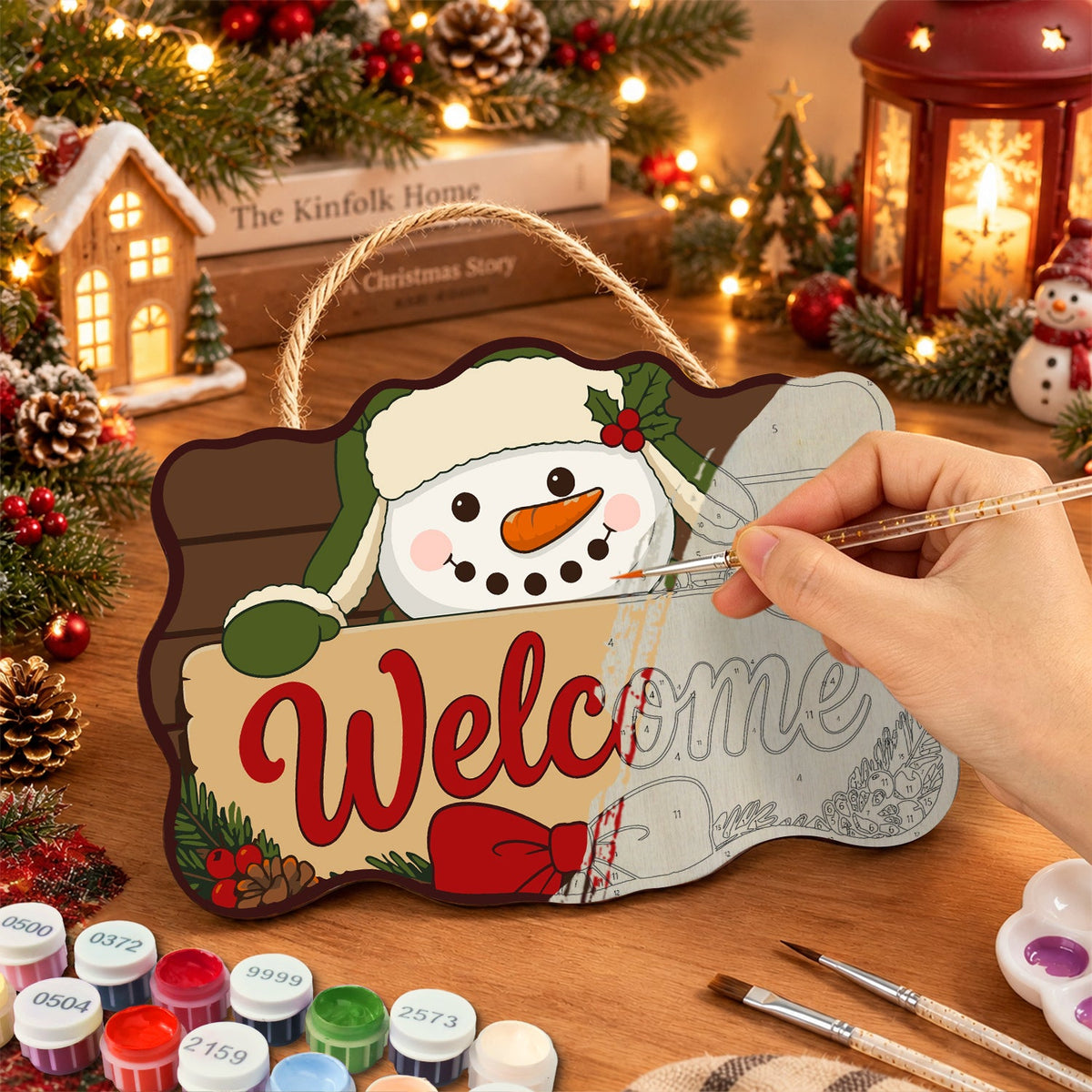 Painting the wooden sign at a festive table