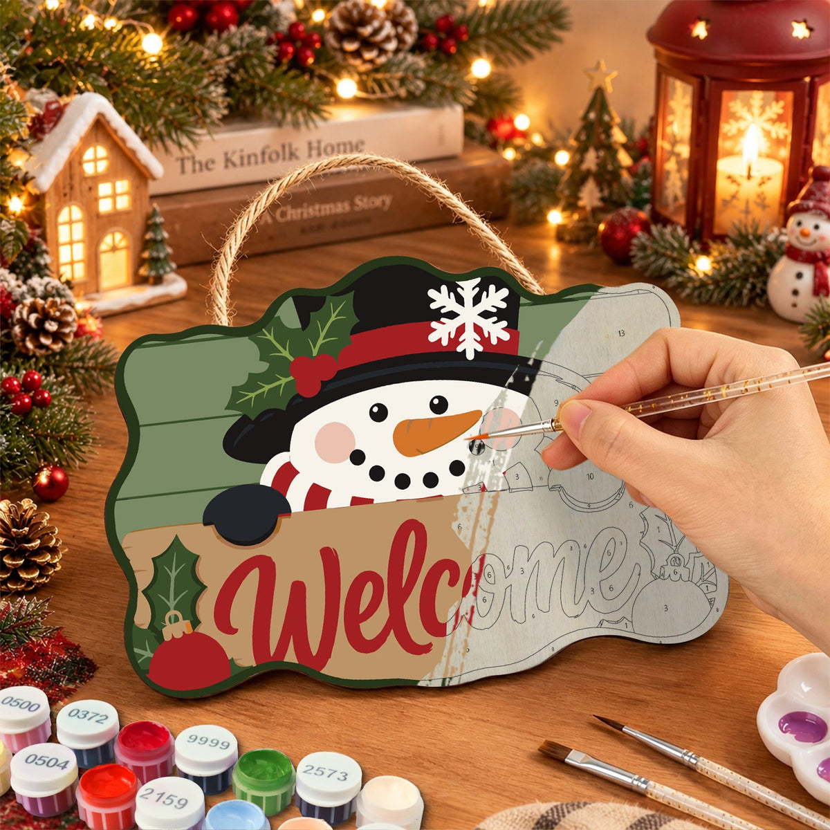 Painting the wooden sign at a festive table