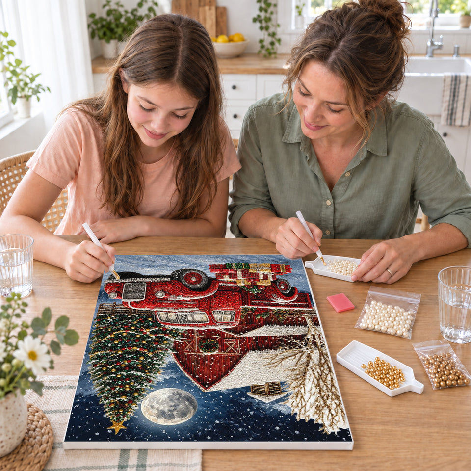Mother and daughter creating one shared Pearl artwork — Red Pickup and Barn Beneath a Christmas Moon. Pearl diamond painting DIY kit by Isuvio.