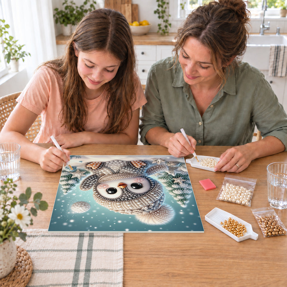 Mother and daughter creating one shared Pearl artwork — Baby Penguin in a Snowy Forest. Pearl diamond painting DIY kit by Isuvio.