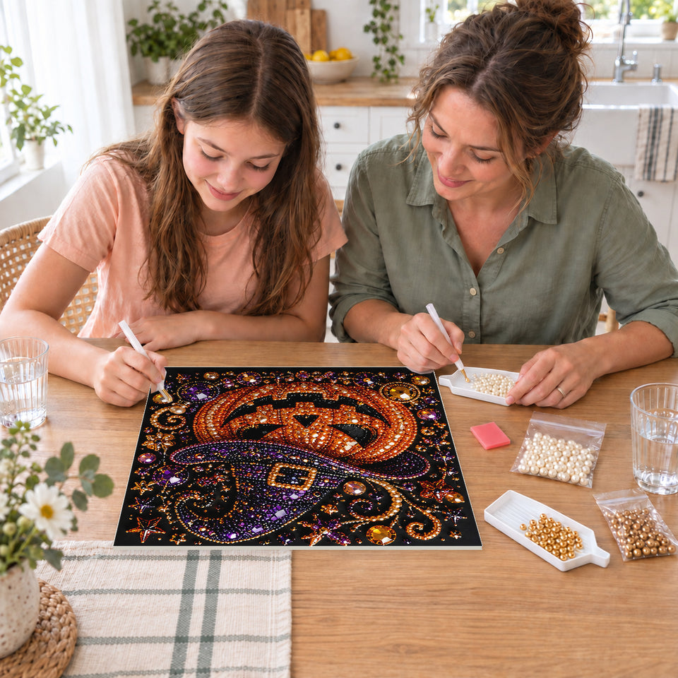 Mother and daughter creating one shared Pearl artwork — Grinning Pumpkin in a Purple Witch Hat. Pearl diamond painting DIY kit by Isuvio.