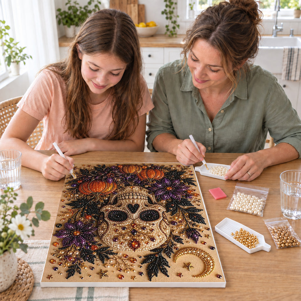 Mother and daughter creating one shared Pearl artwork — Golden Skull with Purple Flowers and Pumpkins. Pearl diamond painting DIY kit by Isuvio.