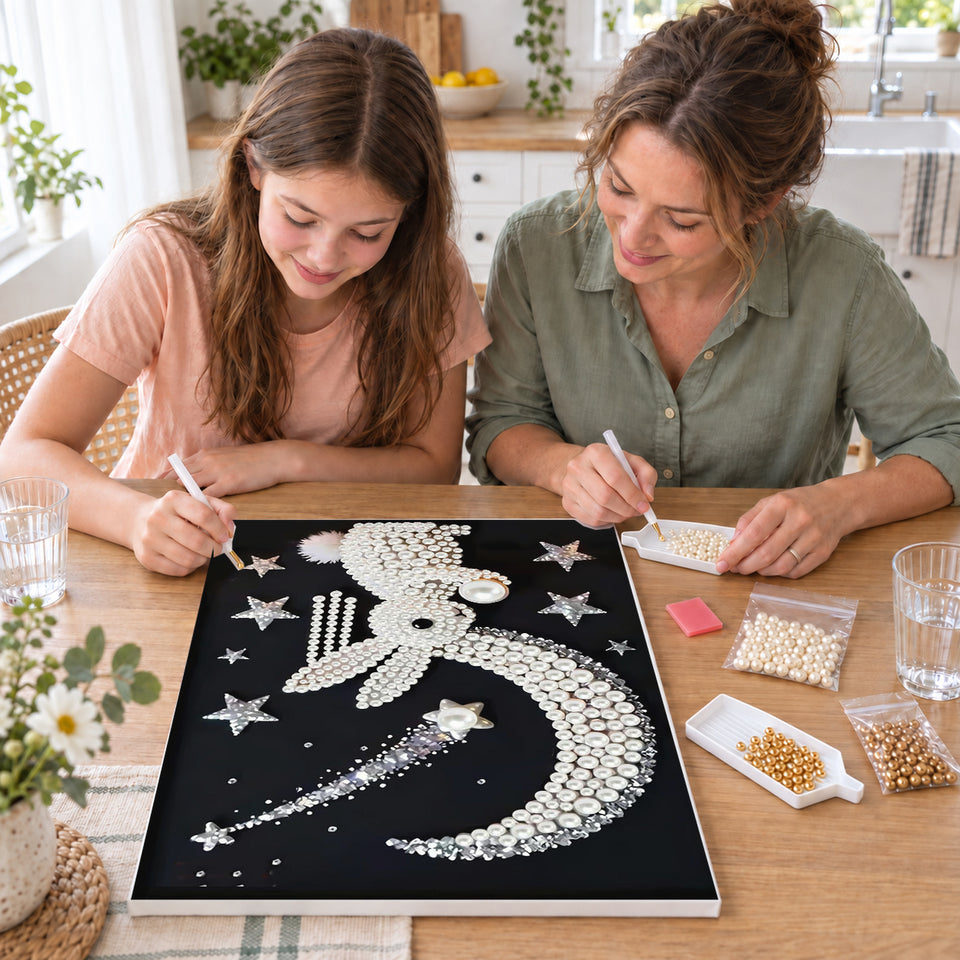 Mother and daughter creating one shared Pearl artwork — Pearl Rabbit Beneath a Crescent and Shooting Star. Pearl diamond painting DIY kit by Isuvio.