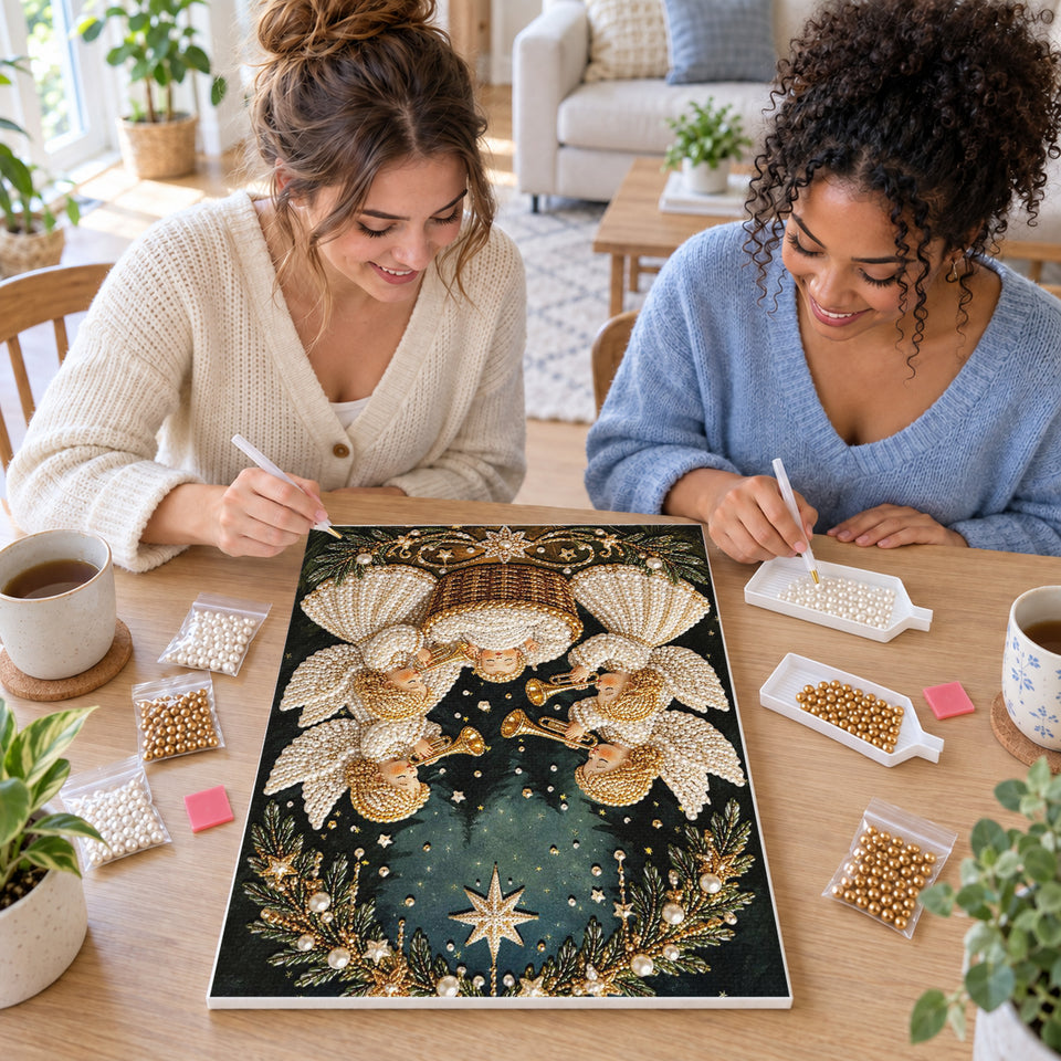 Two friends creating one shared Pearl artwork — Four Christmas Angels and Baby Jesus. Pearl diamond painting DIY kit by Isuvio.