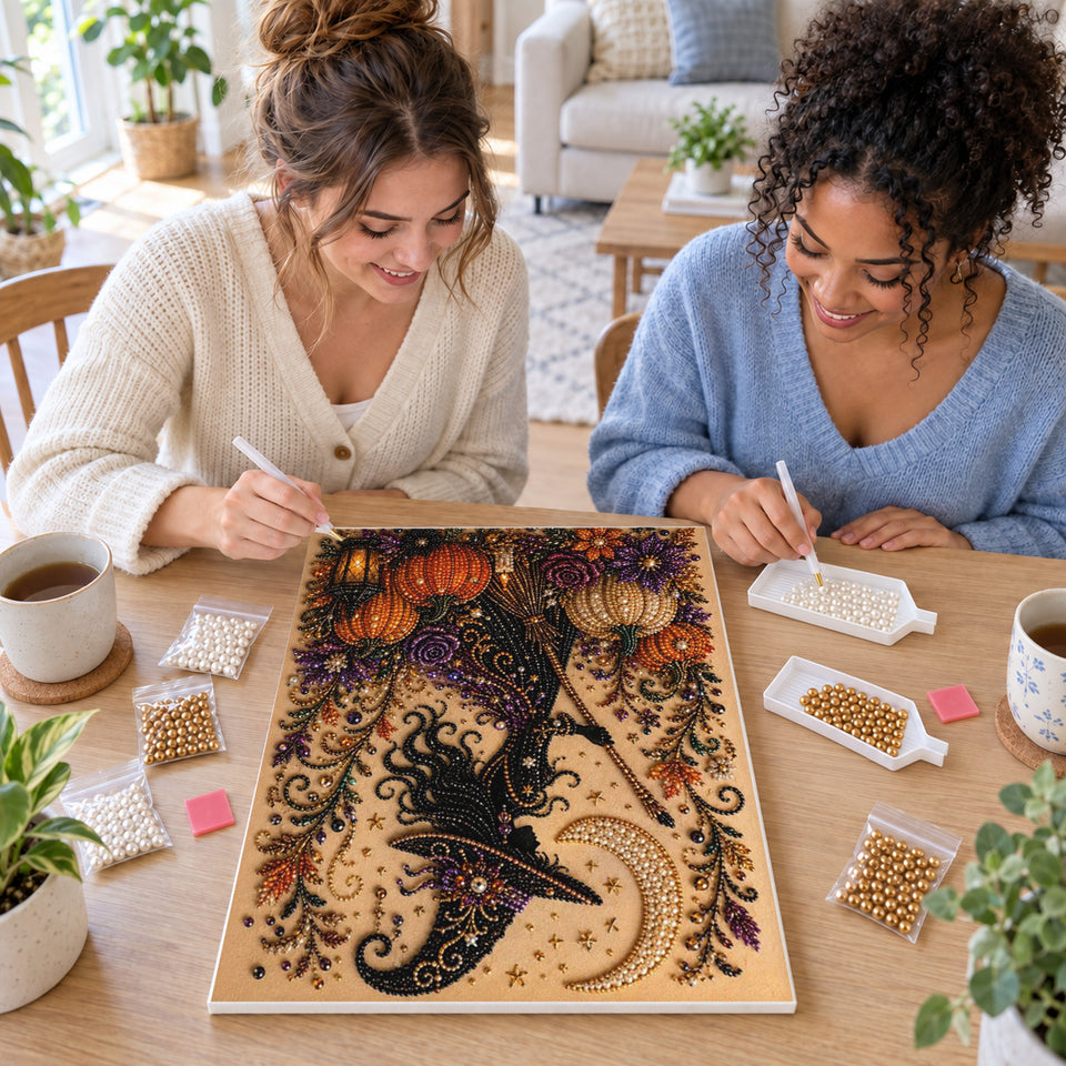 Two friends creating one shared Pearl artwork — Silhouette Witch with Purple Flowers and Pumpkins. Pearl diamond painting DIY kit by Isuvio.