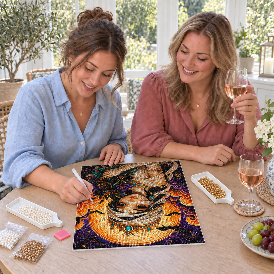 Friends enjoying a sip and craft session — Mummy Princess with a Crown and Autumn Bouquet. Pearl diamond painting DIY kit by Isuvio.