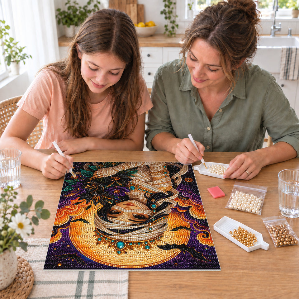 Mother and daughter creating one shared Pearl artwork — Mummy Princess with a Crown and Autumn Bouquet. Pearl diamond painting DIY kit by Isuvio.