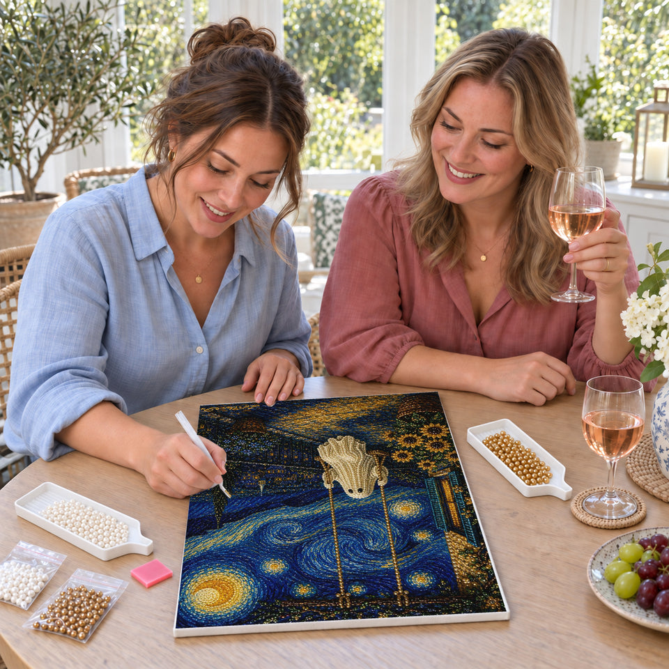 Friends enjoying a sip and craft session — Ghost on a Swing Beneath a Swirling Night Sky. Pearl diamond painting DIY kit by Isuvio.