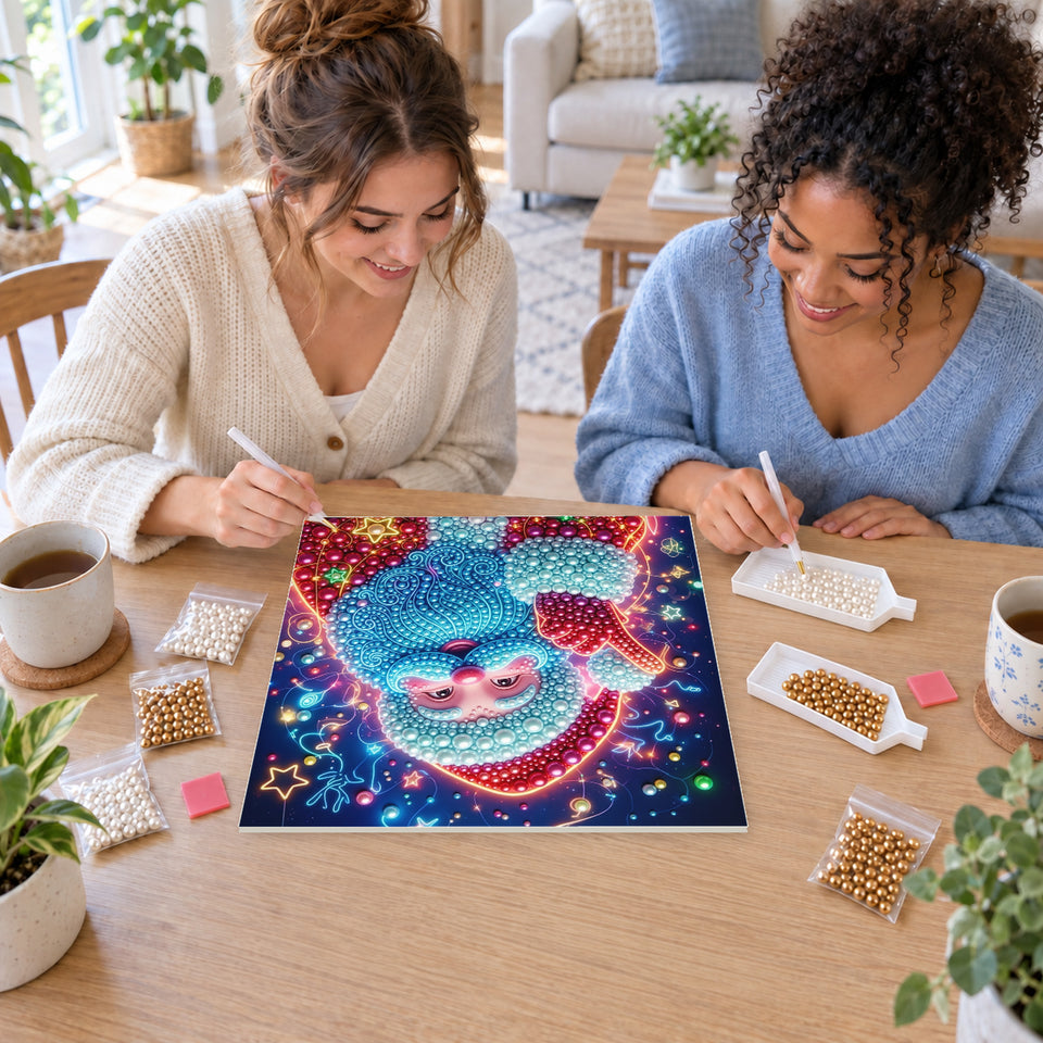 Two friends creating one shared Pearl artwork — Blue-Bearded Santa among Christmas Stars. Pearl diamond painting DIY kit by Isuvio.