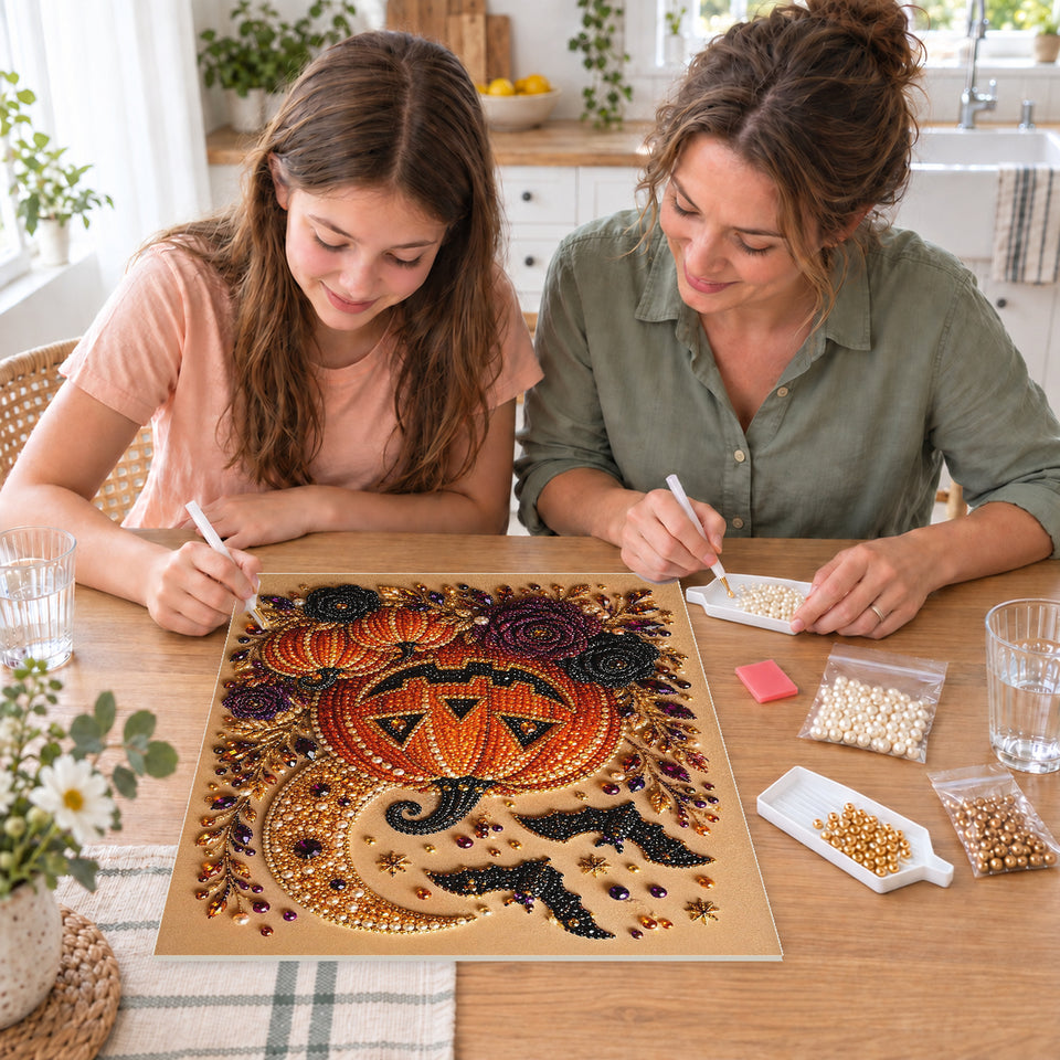 Mother and daughter creating one shared Pearl artwork — Grinning Jack-o'-Lantern with Bats and Dark Roses. Pearl diamond painting DIY kit by Isuvio.