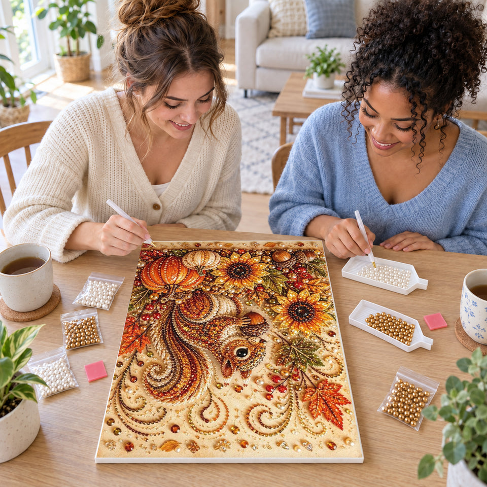 Two friends creating one shared Pearl artwork — Autumn Squirrel with Sunflowers and Pumpkins. Pearl diamond painting DIY kit by Isuvio.
