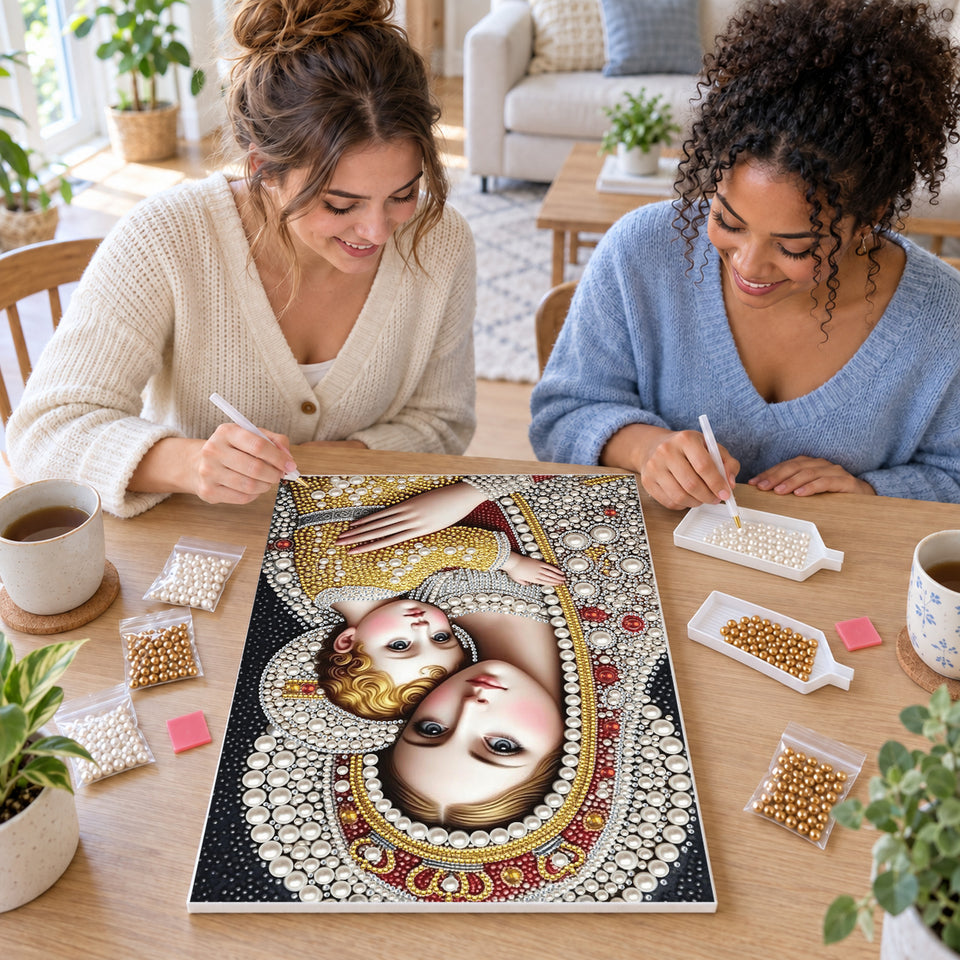 Two friends creating one shared Pearl artwork — Madonna and Child with Pearl Crowns. Pearl diamond painting DIY kit by Isuvio.