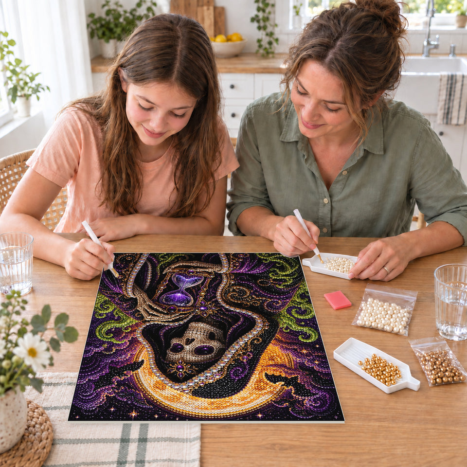 Mother and daughter creating one shared Pearl artwork — Hooded Skeleton Holding a Purple Hourglass. Pearl diamond painting DIY kit by Isuvio.