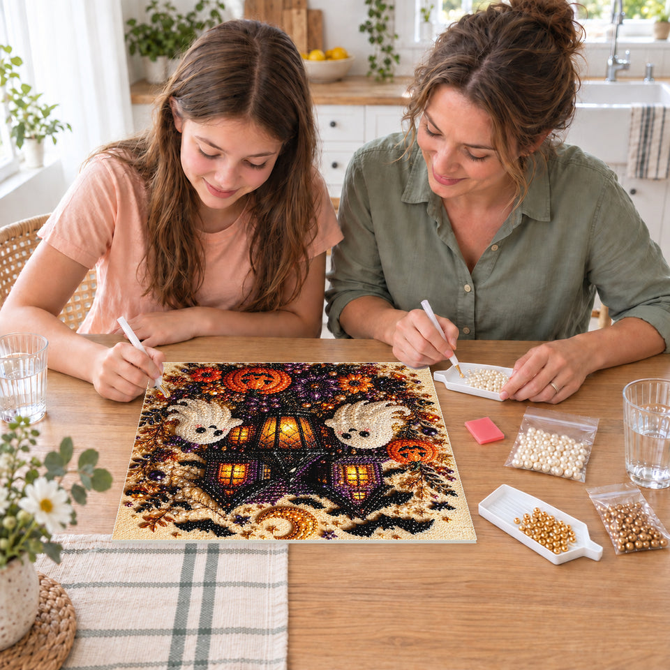 Mother and daughter creating one shared Pearl artwork — Haunted House with Friendly Ghosts and Pumpkins. Pearl diamond painting DIY kit by Isuvio.