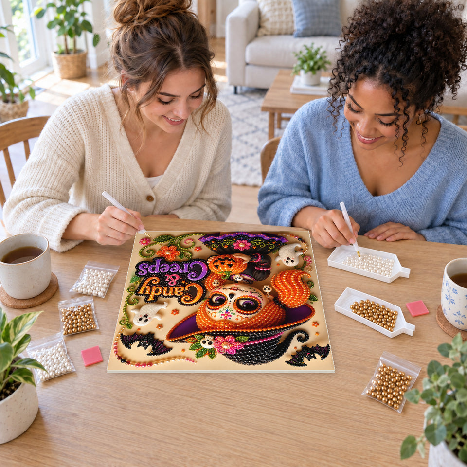 Two friends creating one shared Pearl artwork — Candy and Creeps Little Witch. Pearl diamond painting DIY kit by Isuvio.