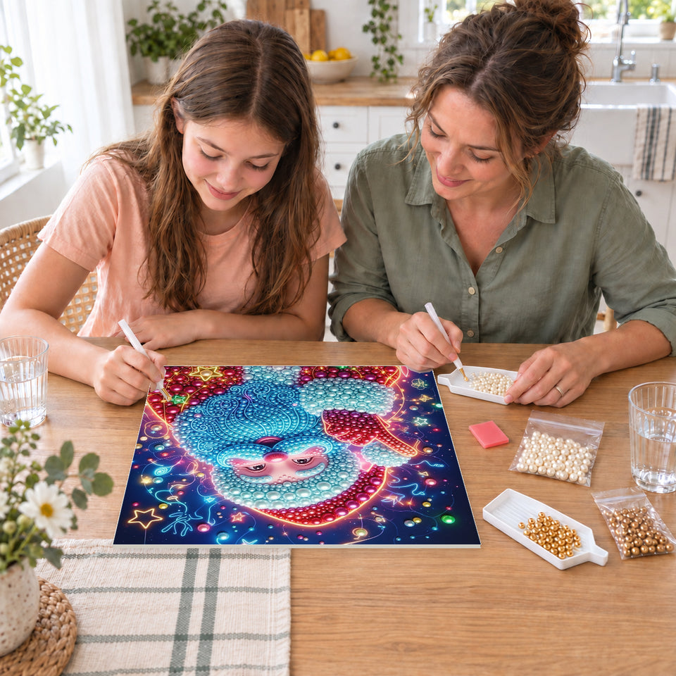 Mother and daughter creating one shared Pearl artwork — Blue-Bearded Santa among Christmas Stars. Pearl diamond painting DIY kit by Isuvio.