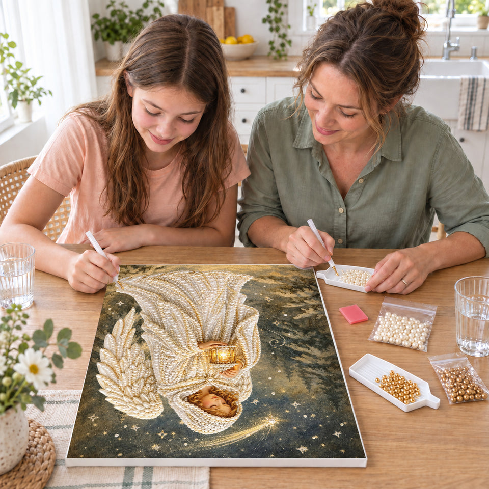 Mother and daughter creating one shared Pearl artwork — Angel with Lantern Under a Shooting Star. Pearl diamond painting DIY kit by Isuvio.