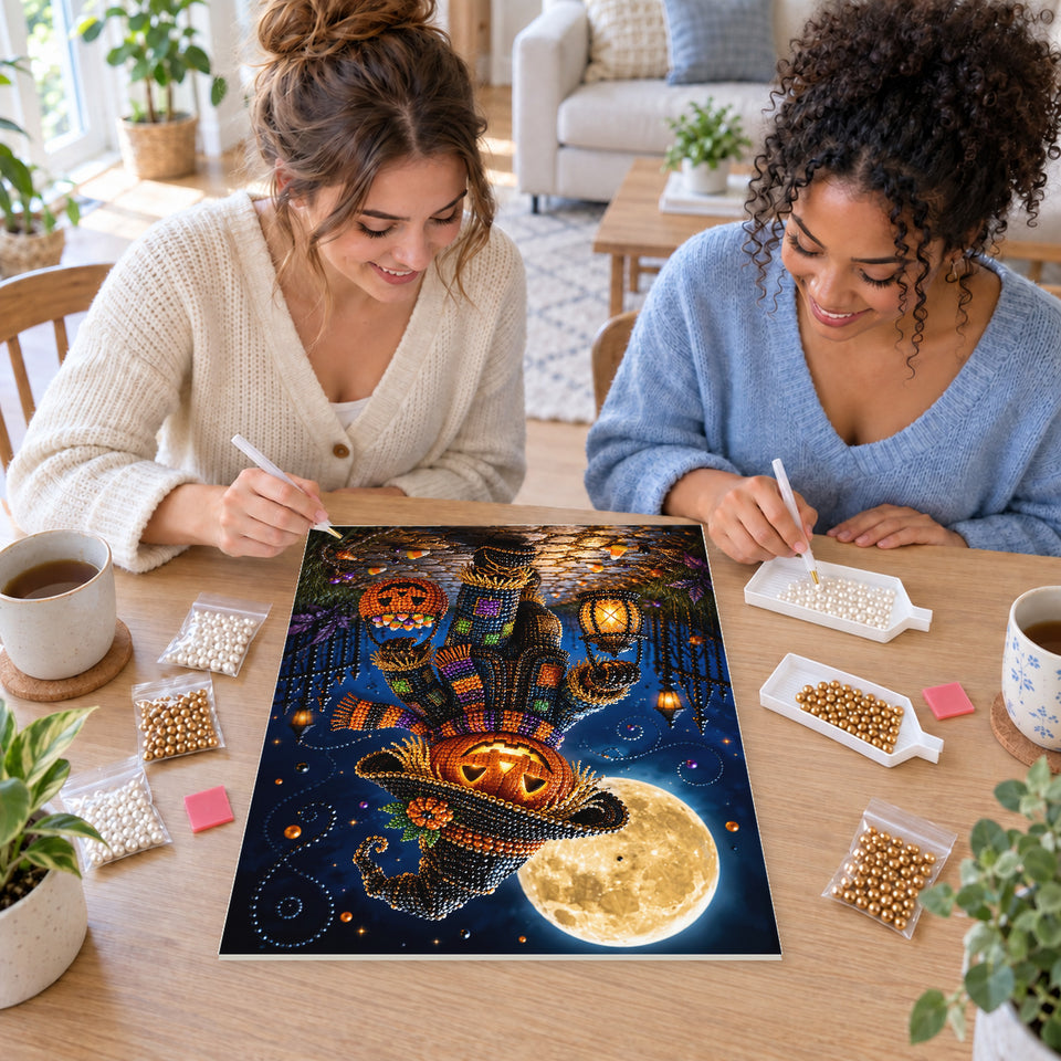 Two friends creating one shared Pearl artwork — Pumpkin Scarecrow with a Moonlit Lantern. Pearl diamond painting DIY kit by Isuvio.