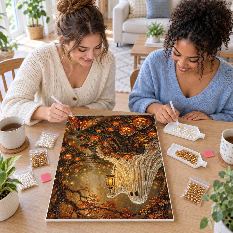 Two friends creating one shared Pearl artwork — Forest Ghost with a Lantern and Glowing Pumpkins. Pearl diamond painting DIY kit by Isuvio.
