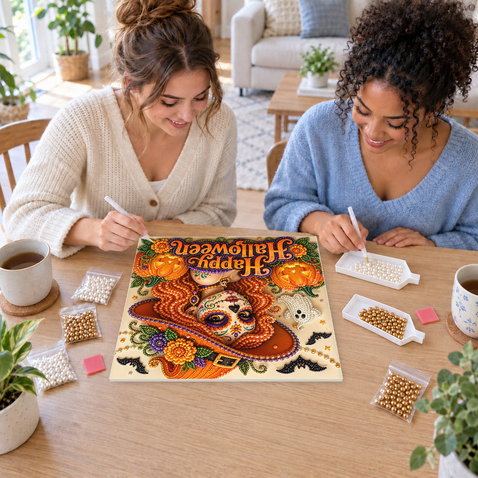 Two friends creating one shared Pearl artwork — Happy Halloween Sugar Skull Witch. Pearl diamond painting DIY kit by Isuvio.