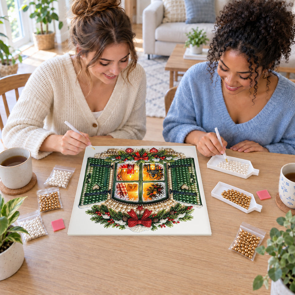 Two friends creating one shared Pearl artwork — Candlelit Christmas Window with Green Shutters. Pearl diamond painting DIY kit by Isuvio.