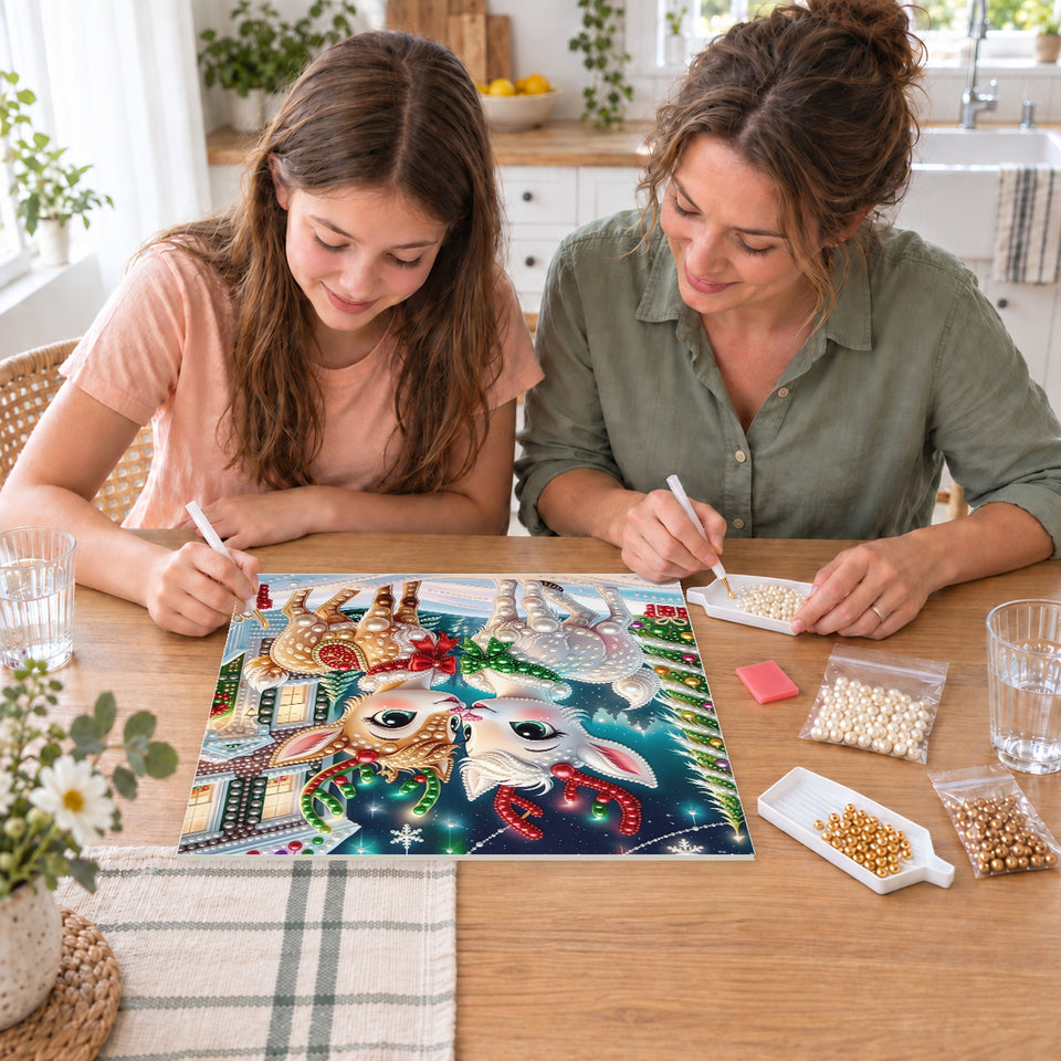 Mother and daughter creating one shared Pearl artwork — Two Festive Fawns in a Snowy Village. Pearl diamond painting DIY kit by Isuvio.