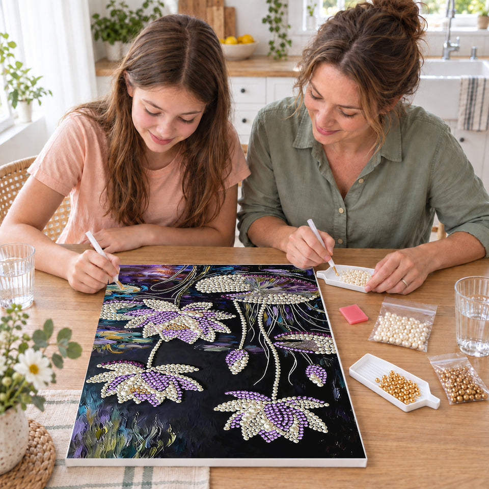 Mother and daughter creating one shared Pearl artwork — Purple and White Water Lilies on a Dark Pond. Pearl diamond painting DIY kit by Isuvio.