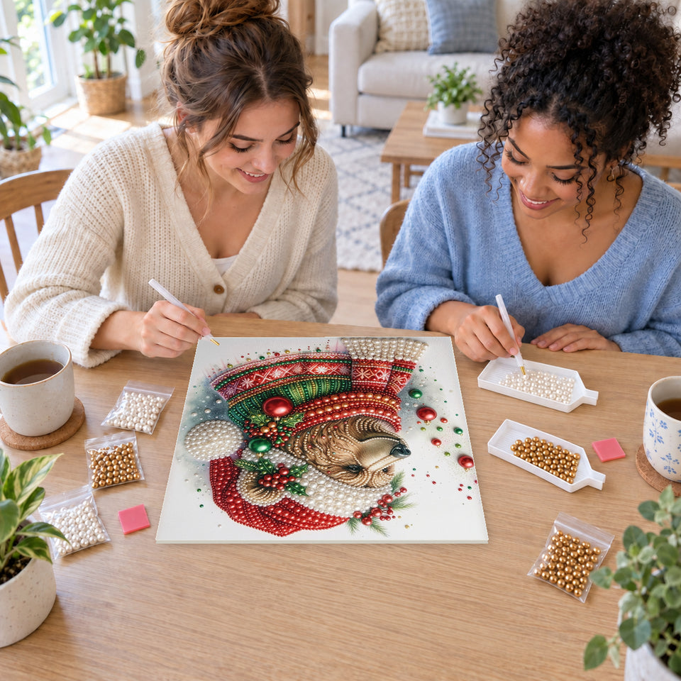 Two friends creating one shared Pearl artwork — Christmas Bear in a Red Nordic Sweater. Pearl diamond painting DIY kit by Isuvio.