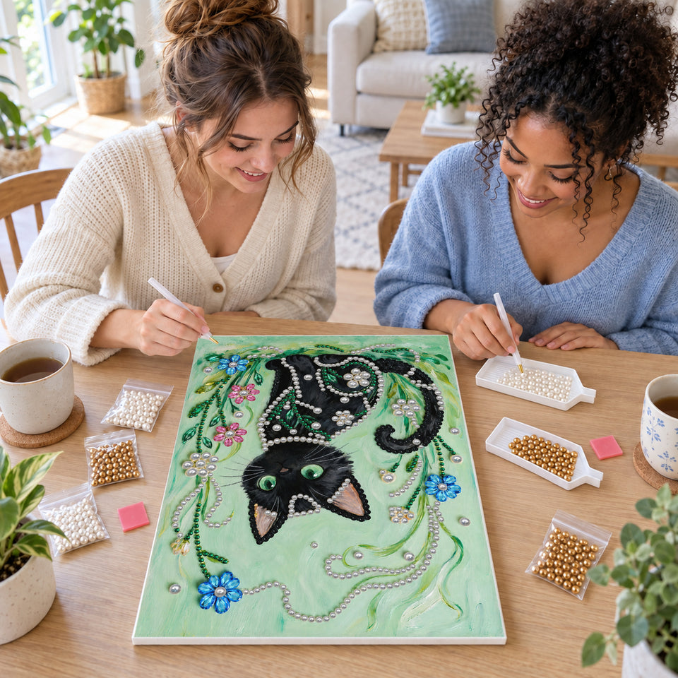 Two friends creating one shared Pearl artwork — Black Cat in Emerald Garden. Pearl diamond painting DIY kit by Isuvio.