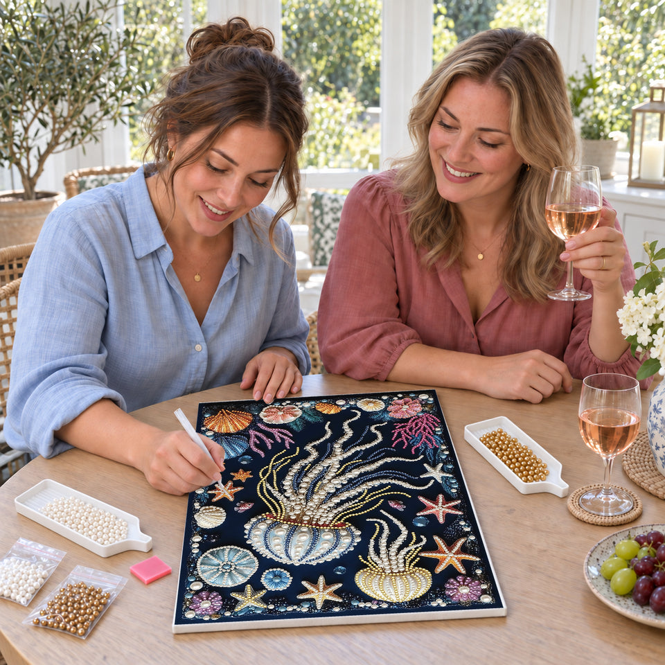 Friends enjoying a sip and craft session — Pearl Jellyfish with Colorful Coral and Seashells. Pearl diamond painting DIY kit by Isuvio.