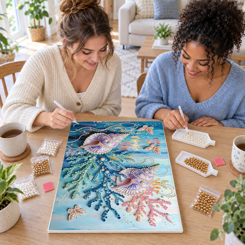 Two friends creating one shared Pearl artwork — Purple Seashells Among Colorful Coral. Pearl diamond painting DIY kit by Isuvio.
