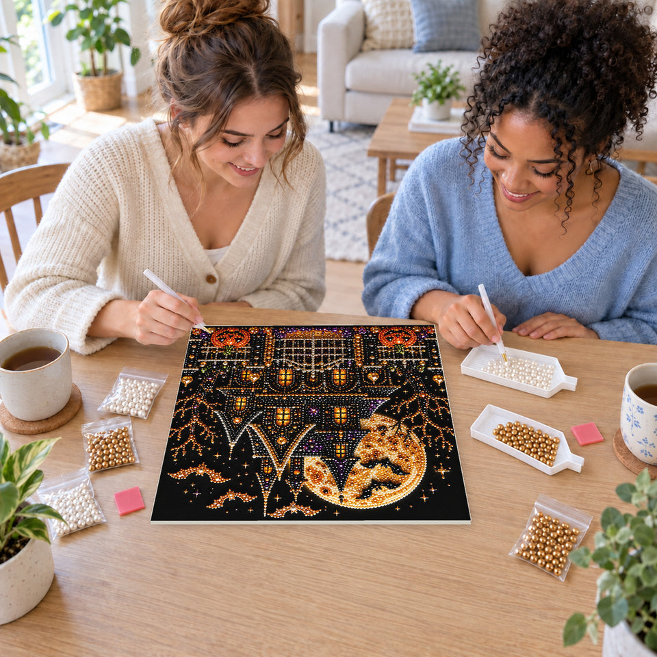 Two friends creating one shared Pearl artwork — Golden Moon Haunted Mansion. Pearl diamond painting DIY kit by Isuvio.