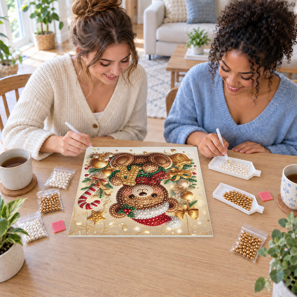 Two friends creating one shared Pearl artwork — Christmas Teddy Bear with the Letter R. Pearl diamond painting DIY kit by Isuvio.