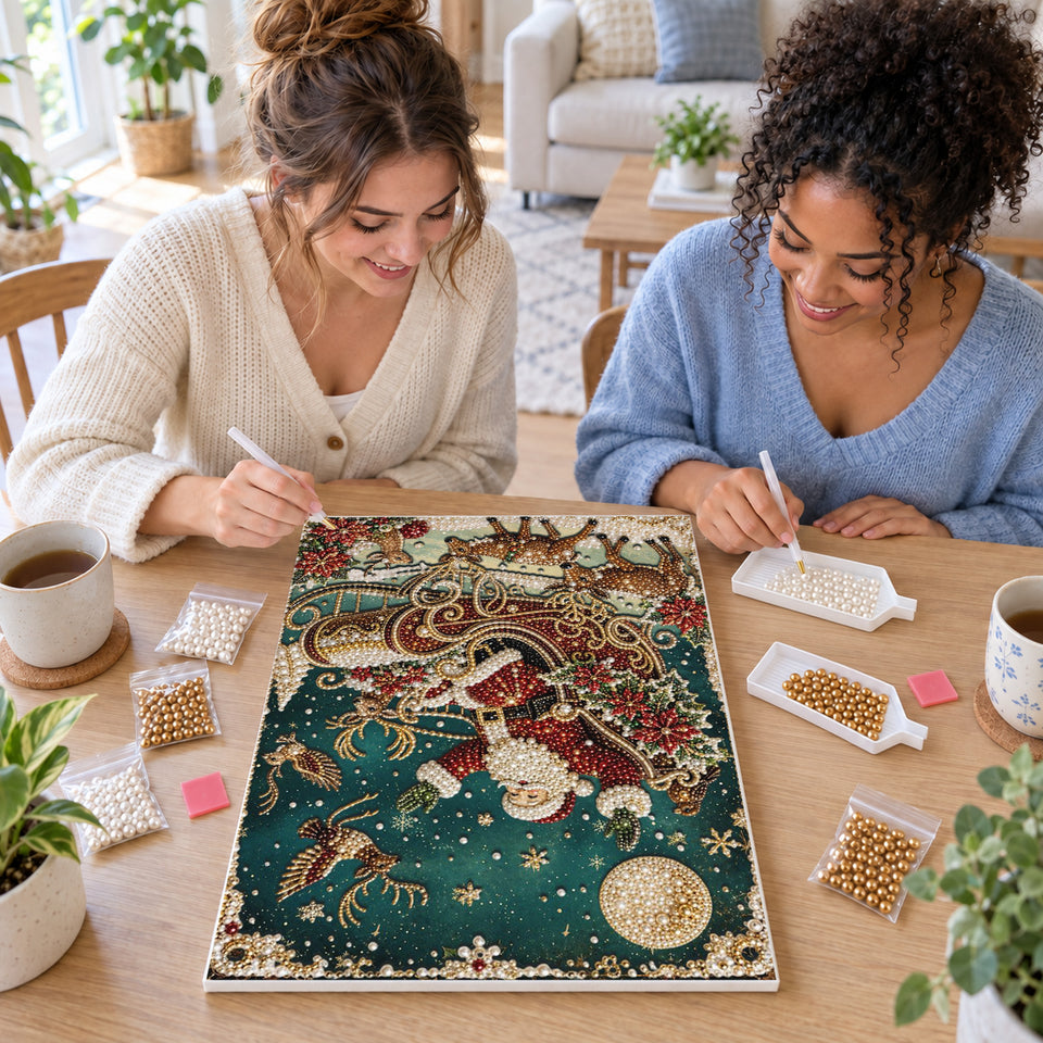 Two friends creating one shared Pearl artwork — Celestial Santa Sleigh in Teal. Pearl diamond painting DIY kit by Isuvio.