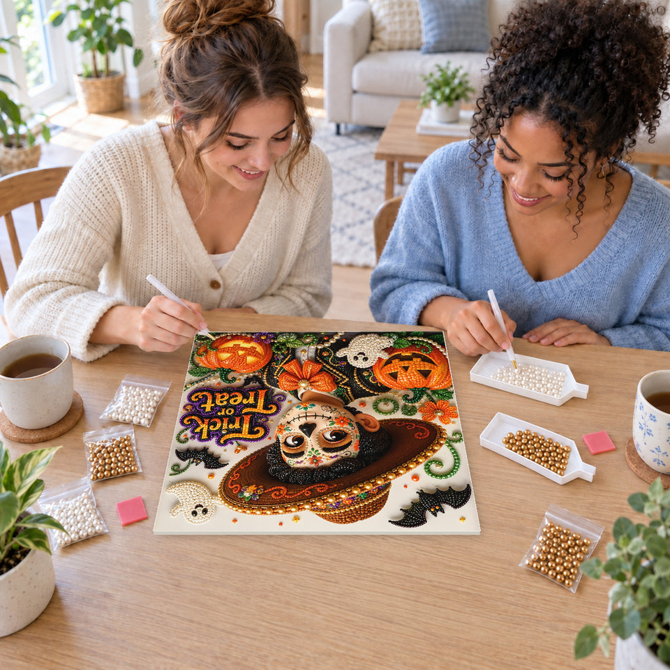 Two friends creating one shared Pearl artwork — Trick Treat Sugar Skull Gentleman. Pearl diamond painting DIY kit by Isuvio.