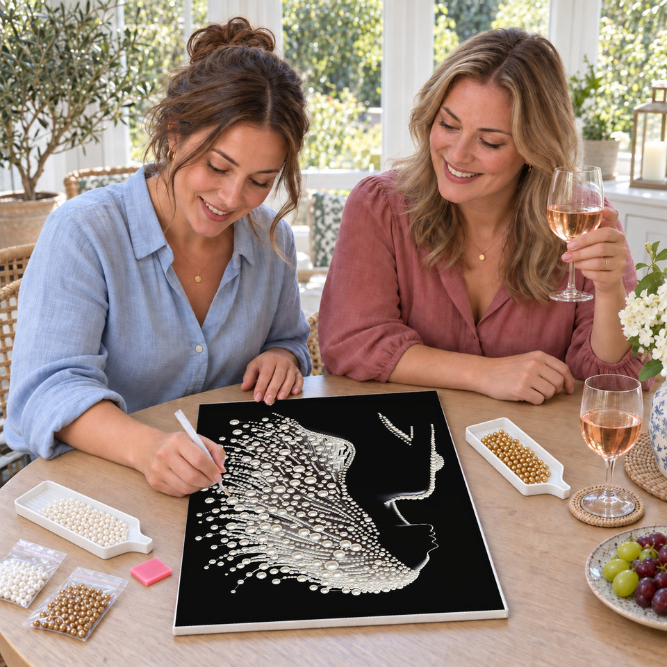 Friends enjoying a sip and craft session — Woman in Profile with Flowing White Pearl Hair. Pearl diamond painting DIY kit by Isuvio.