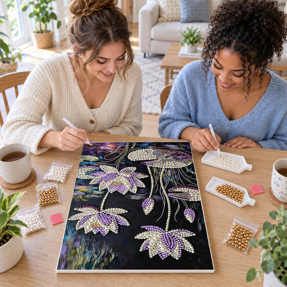Two friends creating one shared Pearl artwork — Purple and White Water Lilies on a Dark Pond. Pearl diamond painting DIY kit by Isuvio.