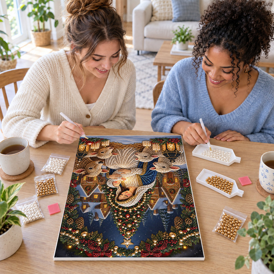 Two friends creating one shared Pearl artwork — Mary and Baby Jesus in Christmas Village. Pearl diamond painting DIY kit by Isuvio.