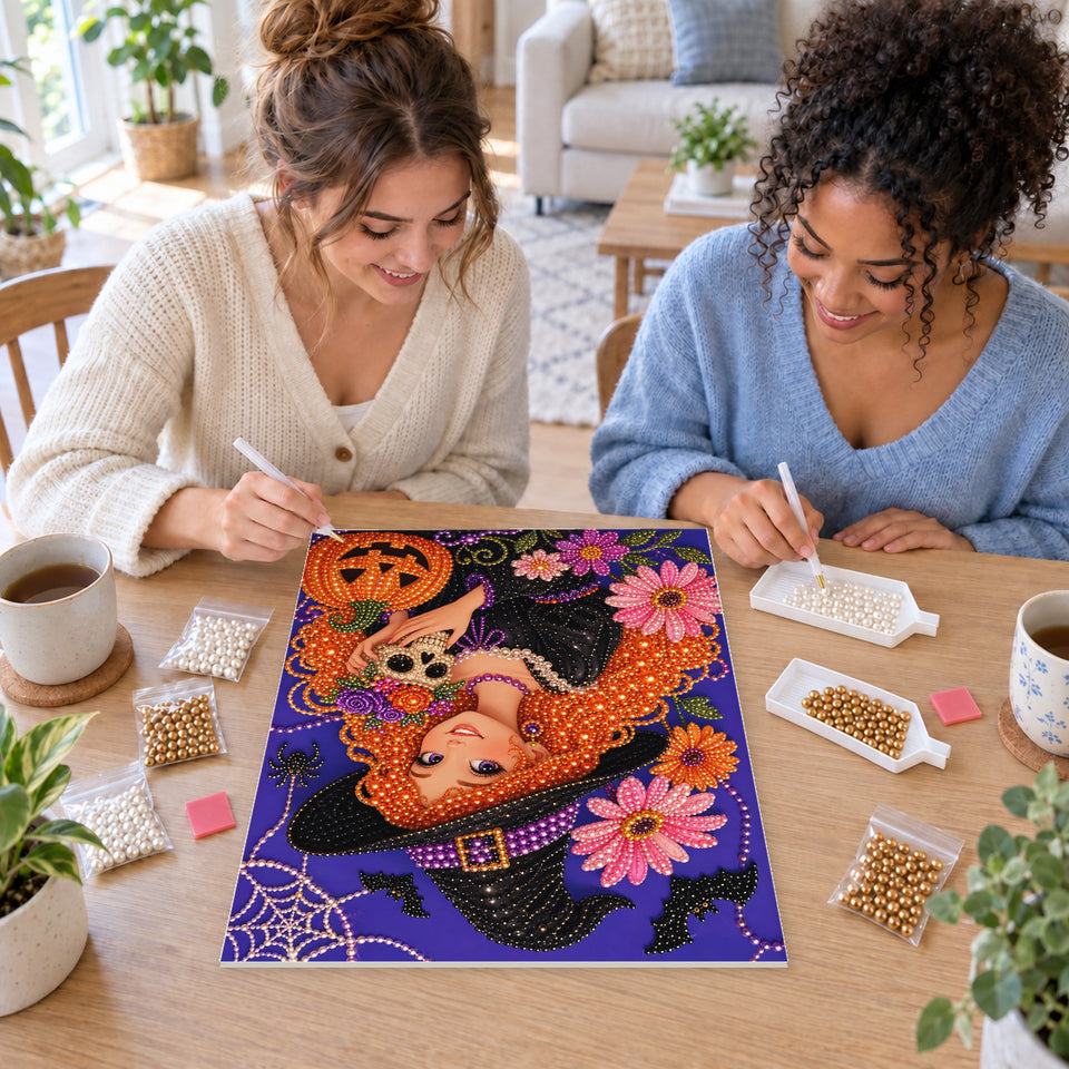 Two friends creating one shared Pearl artwork — Smiling Red-Haired Witch with a Little Skull. Pearl diamond painting DIY kit by Isuvio.