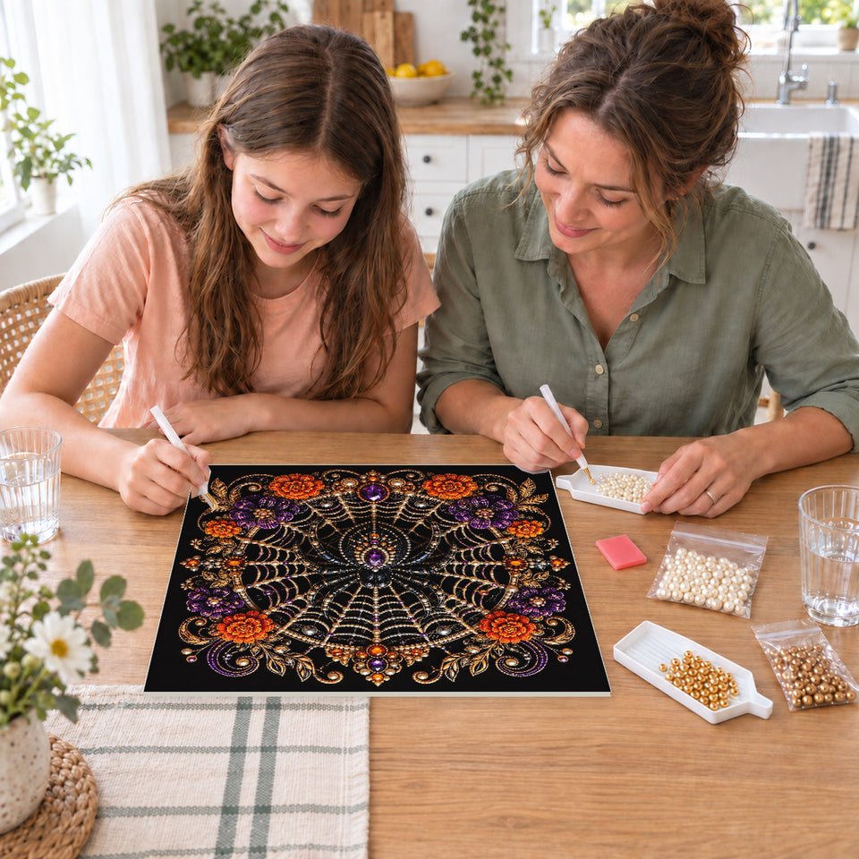 Mother and daughter creating one shared Pearl artwork — Jeweled Spiderweb with Purple and Orange Flowers. Pearl diamond painting DIY kit by Isuvio.