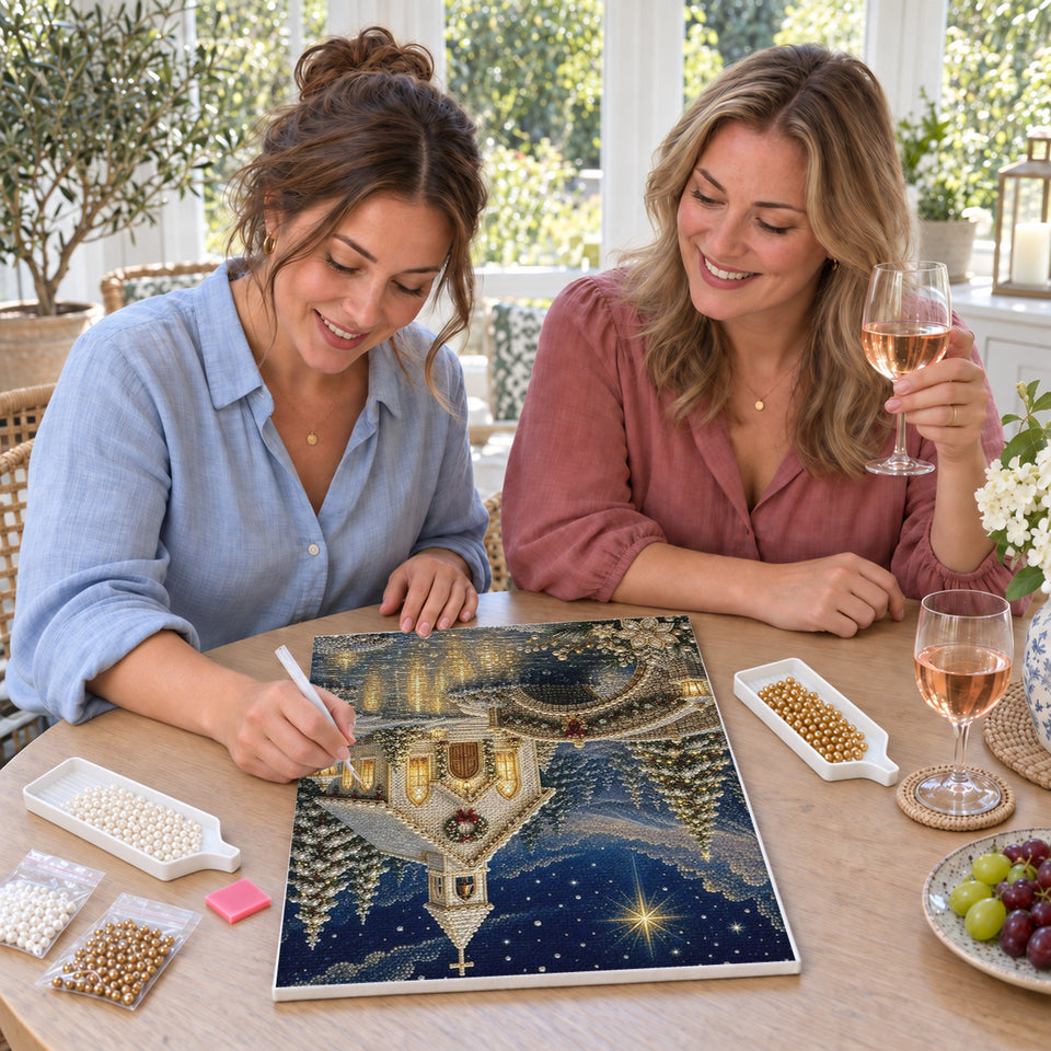 Friends enjoying a sip and craft session — Christmas Chapel Beside a Stone Bridge. Pearl diamond painting DIY kit by Isuvio.