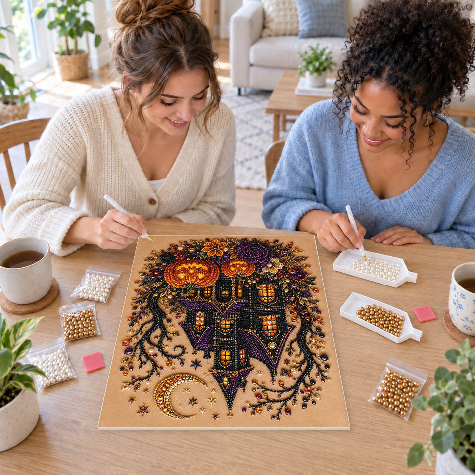 Two friends creating one shared Pearl artwork — Purple-Roofed Haunted House with Pumpkins and Roses. Pearl diamond painting DIY kit by Isuvio.