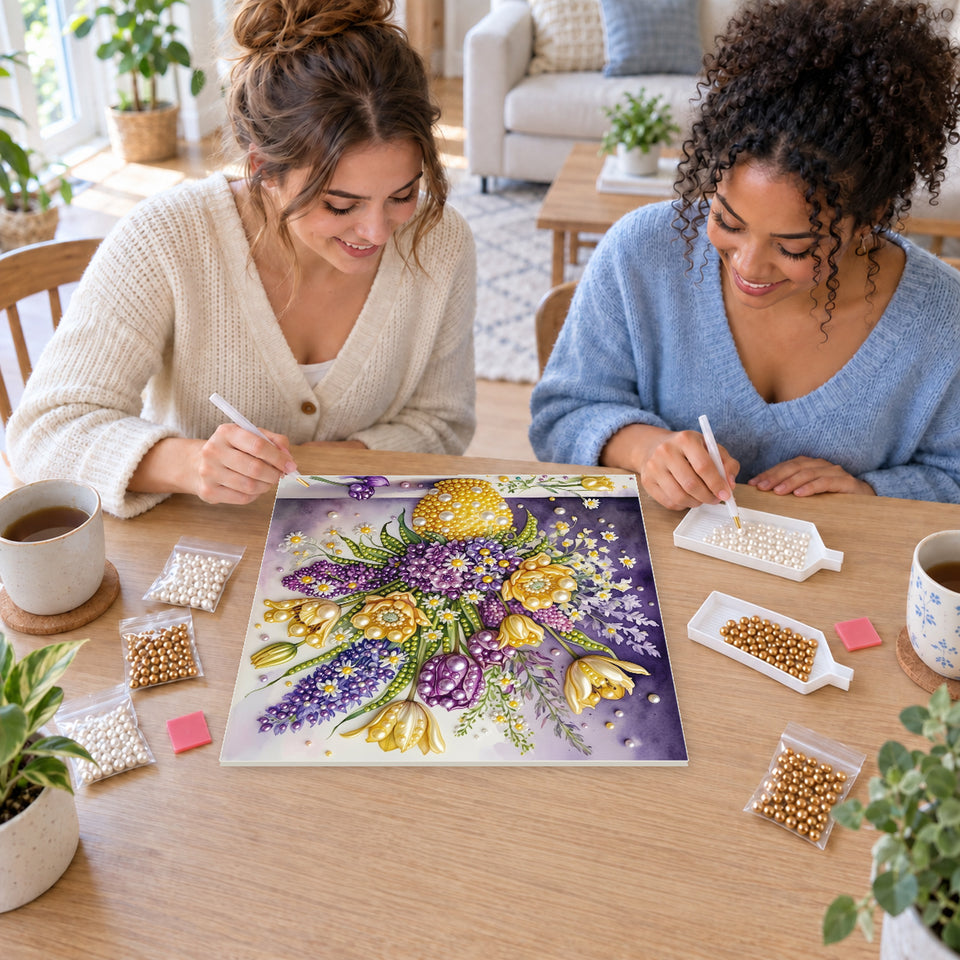 Two friends creating one shared Pearl artwork — Yellow and Purple Flowers in a Pearl Vase. Pearl diamond painting DIY kit by Isuvio.