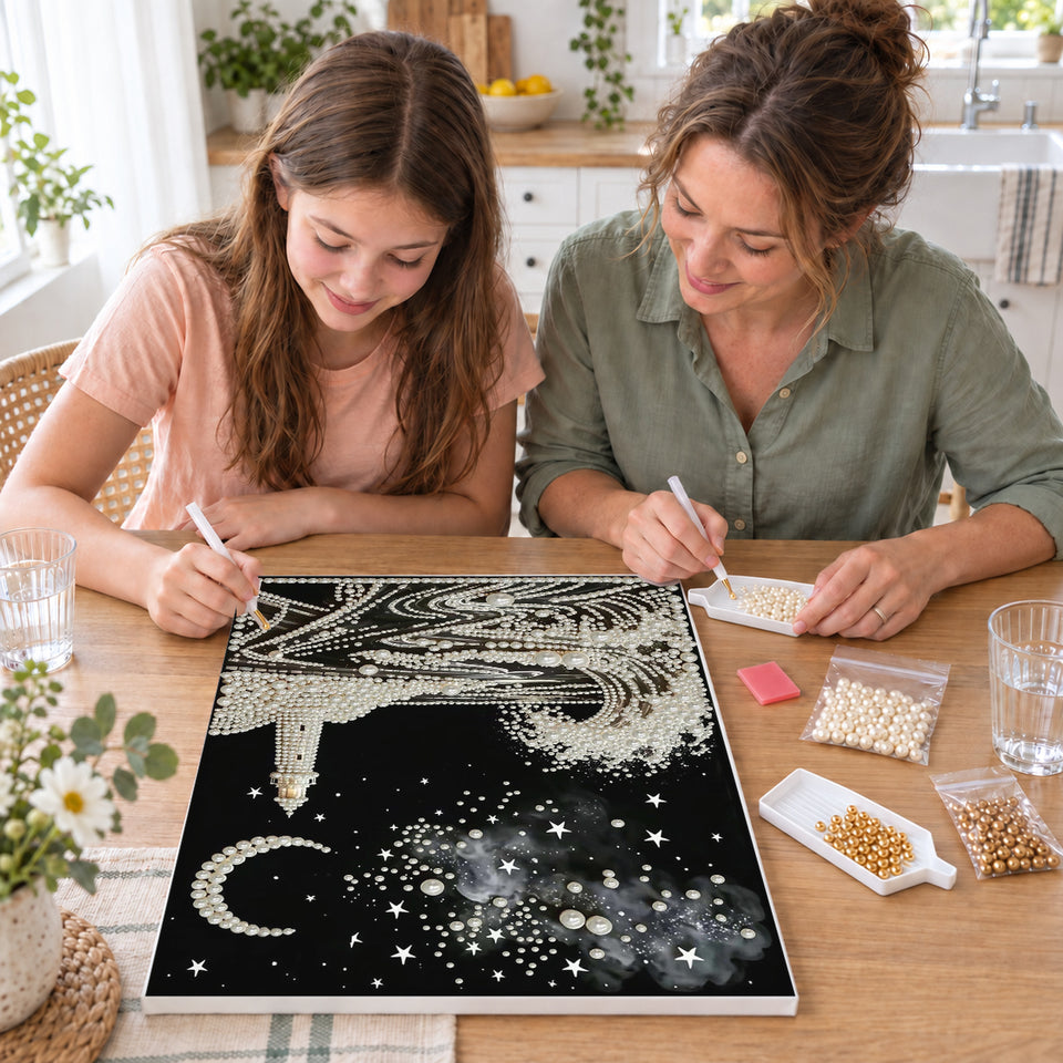 Mother and daughter creating one shared Pearl artwork — Pearl Lighthouse Beneath a Crescent Moon. Pearl diamond painting DIY kit by Isuvio.