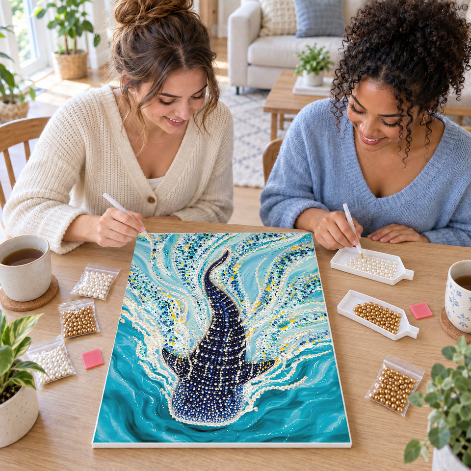Two friends creating one shared Pearl artwork — Whale Shark Swimming Through Turquoise Water. Pearl diamond painting DIY kit by Isuvio.